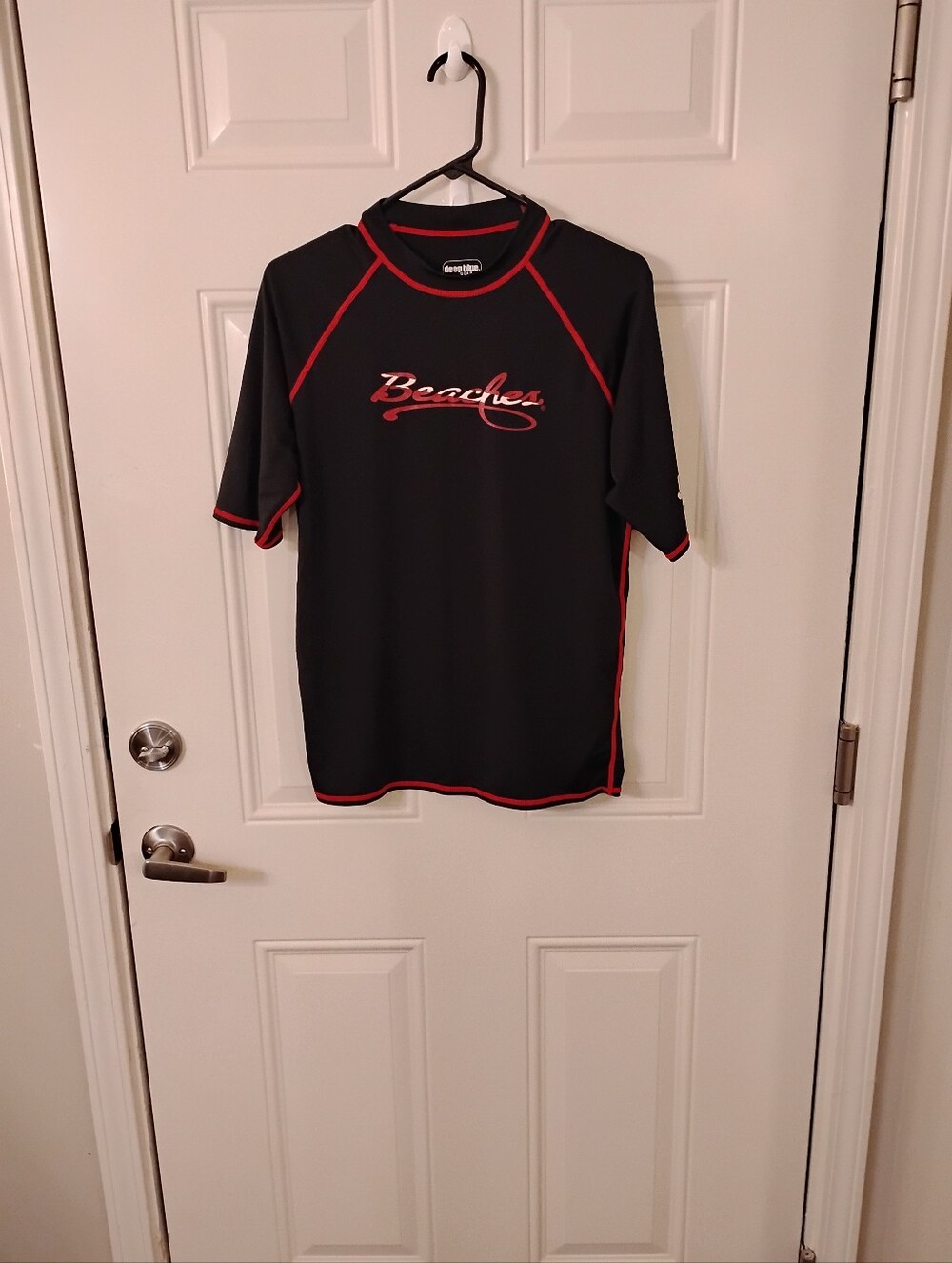 Beaches Logo Rash Guard - Black with Red Trim. Has Jamaica On One Sleeve